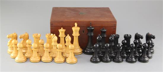 A Jaques & Son Staunton boxwood and ebony chess set, kings 4.25in., board 22 x 21.75in.